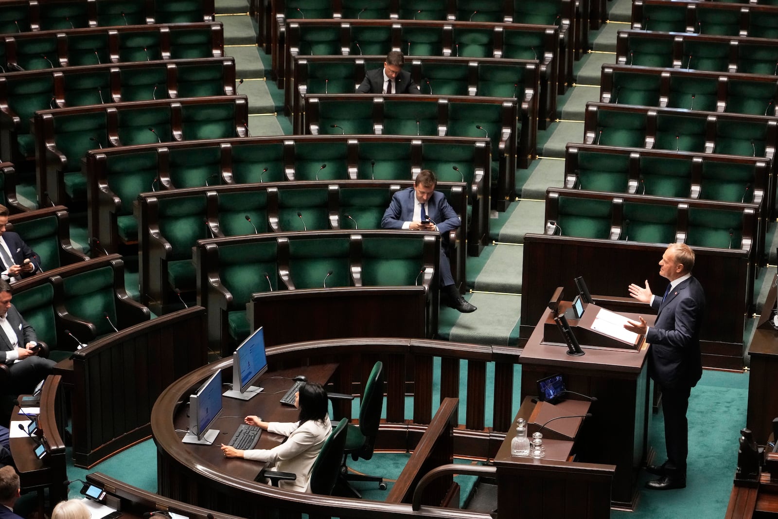 Poland's Prime Minister Donald Tusk addresses the Polish parliament on Wednesday, June 11, 2025, in Warsaw, Poland. (AP Photo/Czarek Sokolowski)