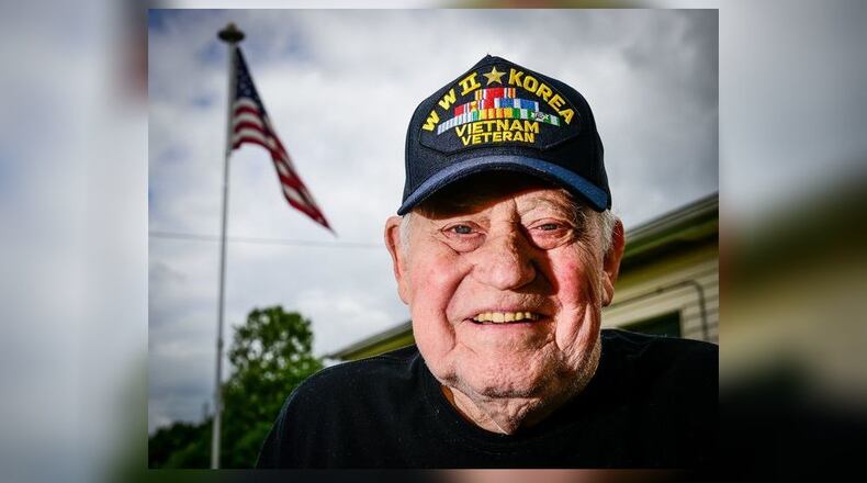 Cecil Daily proudly wore a black baseball hat embroidered with “WWII, Korean, Vietnam Veteran” five years ago when he served as grand marshal of the Middletown Memorial Day Parade. Daily, 94, died Jan. 6. NICK GRAHAM/STAFF