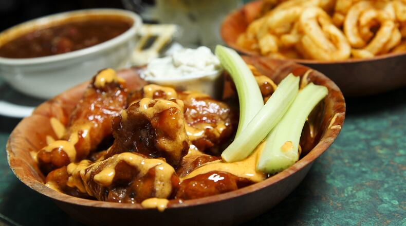 An order of curly fries, chili and wings at Wings on Brookwood. Staff photo by Nick Daggy