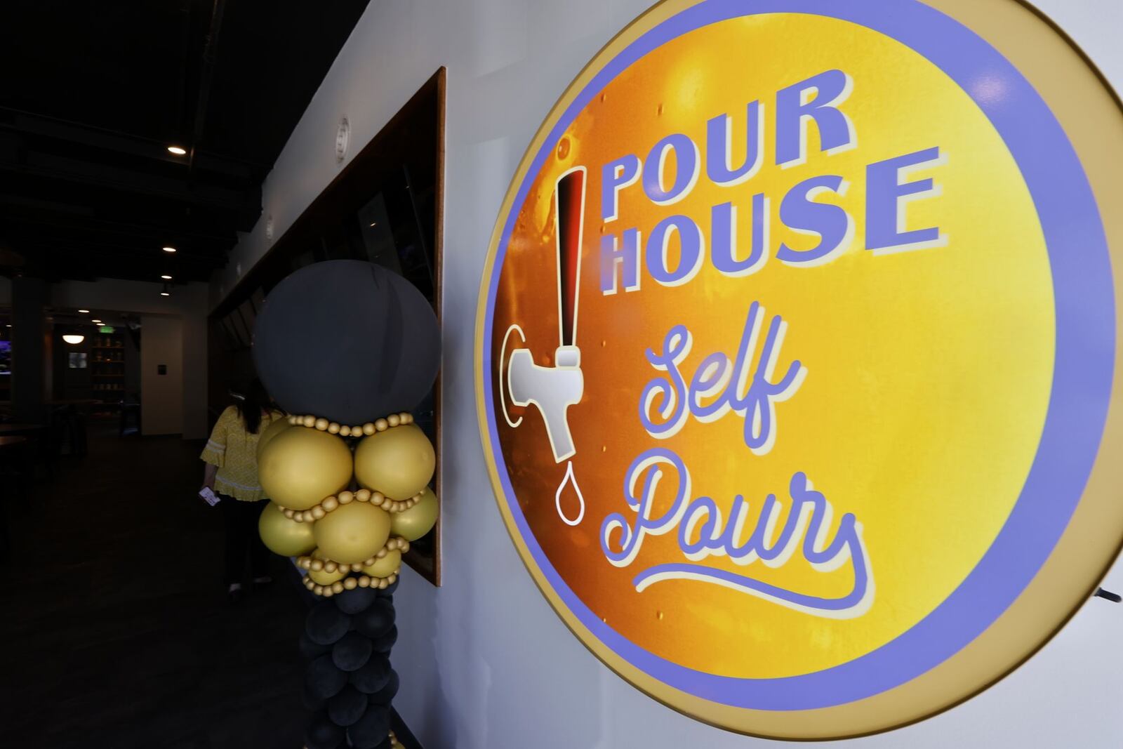 Pour House self-pour tap room opened Friday, May 13, 2022 in The Marcum building in downtown Hamilton. Pour House features 42 taps with a mixture of craft, import and domestic beers, along with a menu of pizza and appetizers. NICK GRAHAM/STAFF