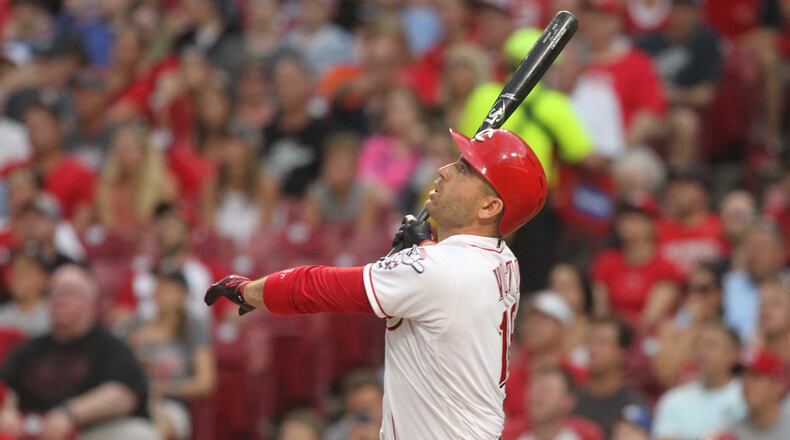 The Reds’ Joey Votto hits a grand slam against the Tigers on Tuesday, June 19, 2018, at Great American Ball Park in Cincinnati. David Jablonski/Staff