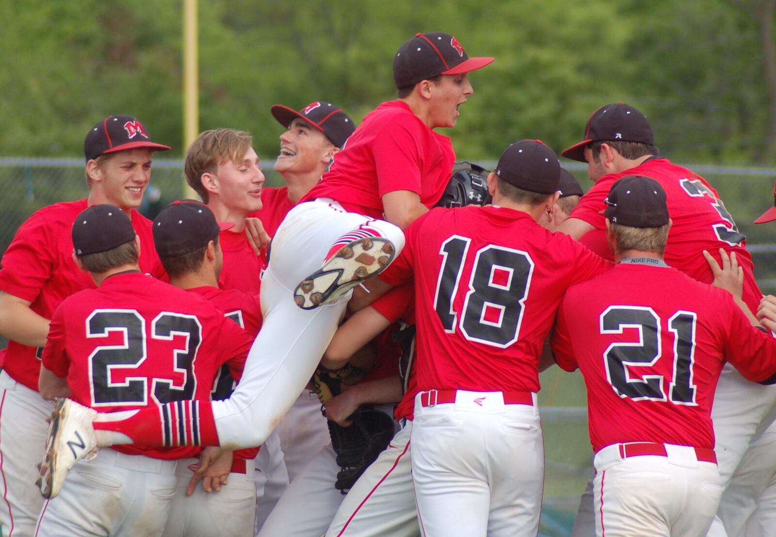 Madison’s players celebrate their 2-1 victory at Fenwick on Friday in a Division II sectional semifinal. CONTRIBUTED PHOTO BY JOHN CUMMINGS