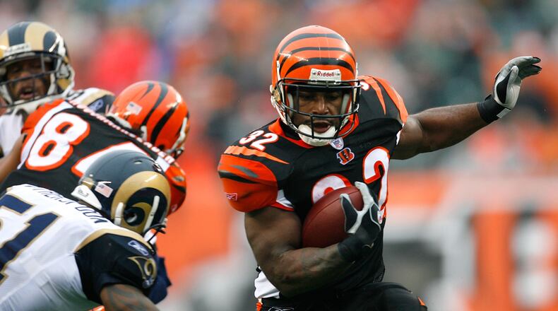 Former Bengals halfback Rudi Johnson, ranked by fans and media as the No. 21 retired Cincinnati player, is see here picking on the Rams in a 2007 game at Paul Brown Stadium.