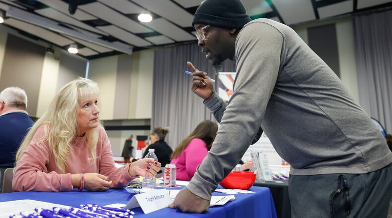 Kelly Eakin, left, new hire trainer of Topre America, speaks with Jean Orange, a Haitian immigrant living in Springfield, during the Clark County Job Fair on Tuesday, April 15, 2025, at the Hollenbeck Bayley Creative Arts and Conference Center. JOSEPH COOKE/STAFF