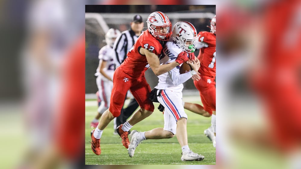 Tippecanoe junior linebacker Raiden Nicholls tackles Talawanda's Jake Van Gorden during a Division III, Region 12 quarterfinal on Friday, Nov. 7 at Tipp City Park. BRYANT BILLING/STAFF