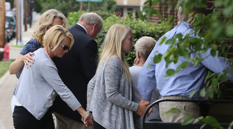 Brooke Skylar Richardson, center, is escorted into court on July 21, 2017, in a preliminary hearing on a charge of reckless homicide in the death of her infant baby, found buried in the backyard of her Carlisle family home. STAFF/GREG LYNCH