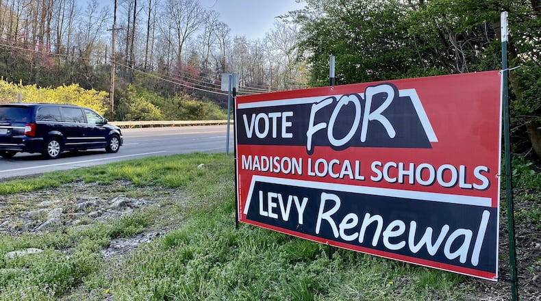 As early voting starts this week Madison Schools supporters are hoping residents start casting their ballots for a tax levy renewal, which if approved, will not increase their school taxes. Yard signs urging residents to approve the 4-mill, 10-year renewal school property tax began popping up this week around the rural district just west of and across the Great Miami River from Middletown. (Photo By Michael D. Clark/Journal-News)