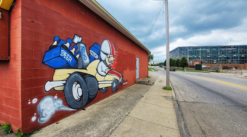 Hamilton is buying properties in the 800 blocks of North 2nd and North 3rd streets , as well as some areas west of the Great Miami River, to create 500-750 more parking spaces for the Spooky Nook Sports Champion Mill development. NICK GRAHAM/STAFF