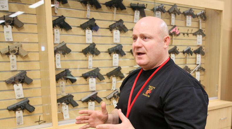 Premier Shooting & Training Center General Manager Jim Lentz talks about gun ownership earlier this year. GREG LYNCH / STAFF