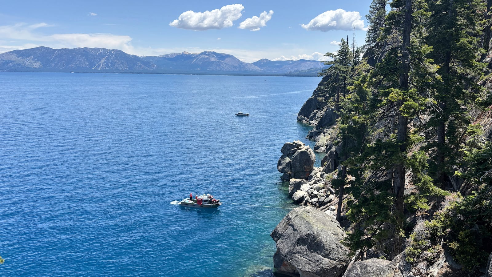 Authorities conduct searches along the shore at D.L. Bliss State Park after a weekend incident in which a boat capsized, killing several people, on Monday, June 23, 2025, in South Lake Tahoe, Calif. (AP Photo/Brooke Hess-Homeier)