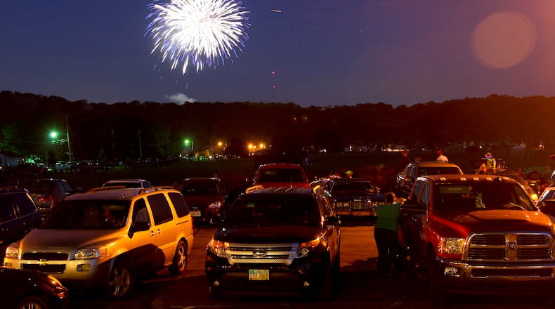 There are several events happening in Butler County for the July 4 holiday. Spectators watch from Fairfield West Baptist Church as fireworks fill the sky in Fairfield during the Red White and Kaboom celebration, July 3, 2014. GREG LYNCH/STAFF