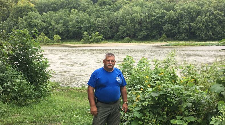 Troy Schwable, who with his wife, Kathy Schwable, is one of the leaders in creating Hamilton’s Riverside Natural Area, stands next to a canoe/kayak launch location near the city’s 33rd river mile. There are no dams downriver at this point, meaning someone can kayak or canoe unimpeded to the Ohio River from the location. MIKE RUTLEDGE/STAFF