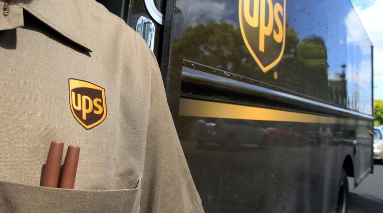 FILE - This April 25, 2011 file photo shows United Parcel Service driver Albert Palafox in Palo Alto, Calif. (AP Photo/Paul Sakuma, File)