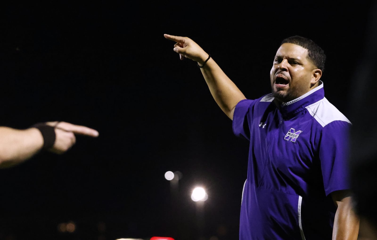 Middletown head football coach Kali Jones expresses his concerns to the referee during their football game against Lakota West Friday, Sept. 26, 2025 at Lakota West High School in West Chester Township. The Firebirds won 27-13 over the Middies. NICK GRAHAM/STAFF