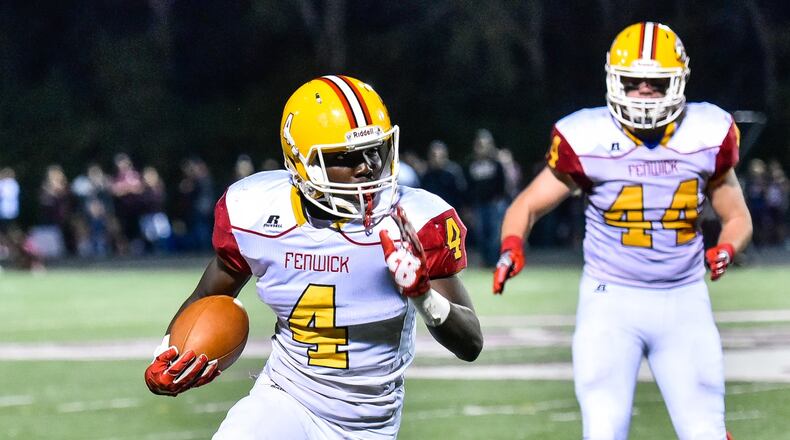 Fenwick’s Caleb Davis carries the ball during a game against Lebanon on Sept. 8 at Jim VanDeGrift Stadium in Lebanon. The host Warriors triumphed 49-27. NICK GRAHAM/STAFF