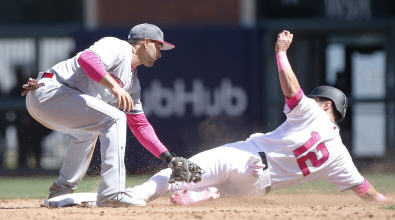 The Giants’ Joe Panik (12) steals second base ahead of the tag from Reds second baseman Jose Peraza in the eighth inning at AT&T Park in San Francisco on Saturday, May 13, 2017. (Jim Gensheimer/Bay Area News Group/TNS)