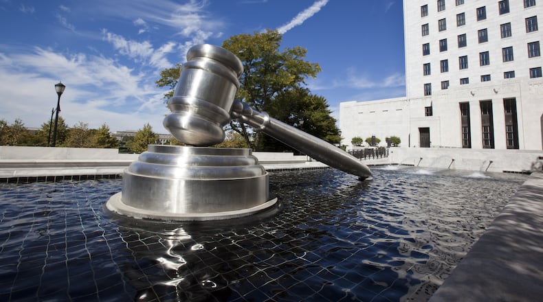 The Gavel Sculpture in downtown Columbus sits in the reflecting pool alongside the Ohio Supreme Court building.