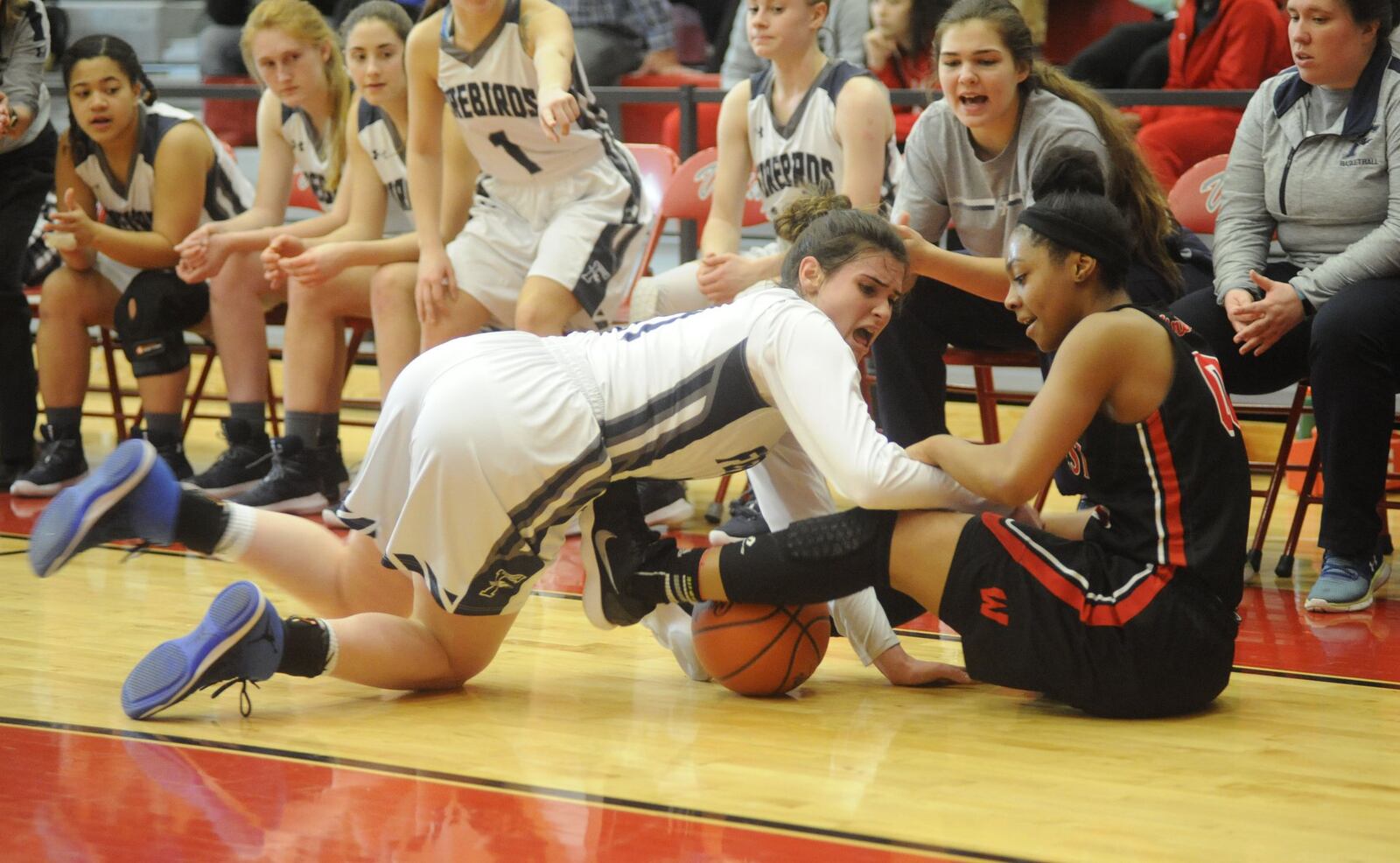 Lakota West’s Jaydis Gales (right) battles Fairmont’s Mali Morgan-Elliott for possession of the ball Saturday afternoon during a Division I district final at Princeton. MARC PENDLETON/STAFF
