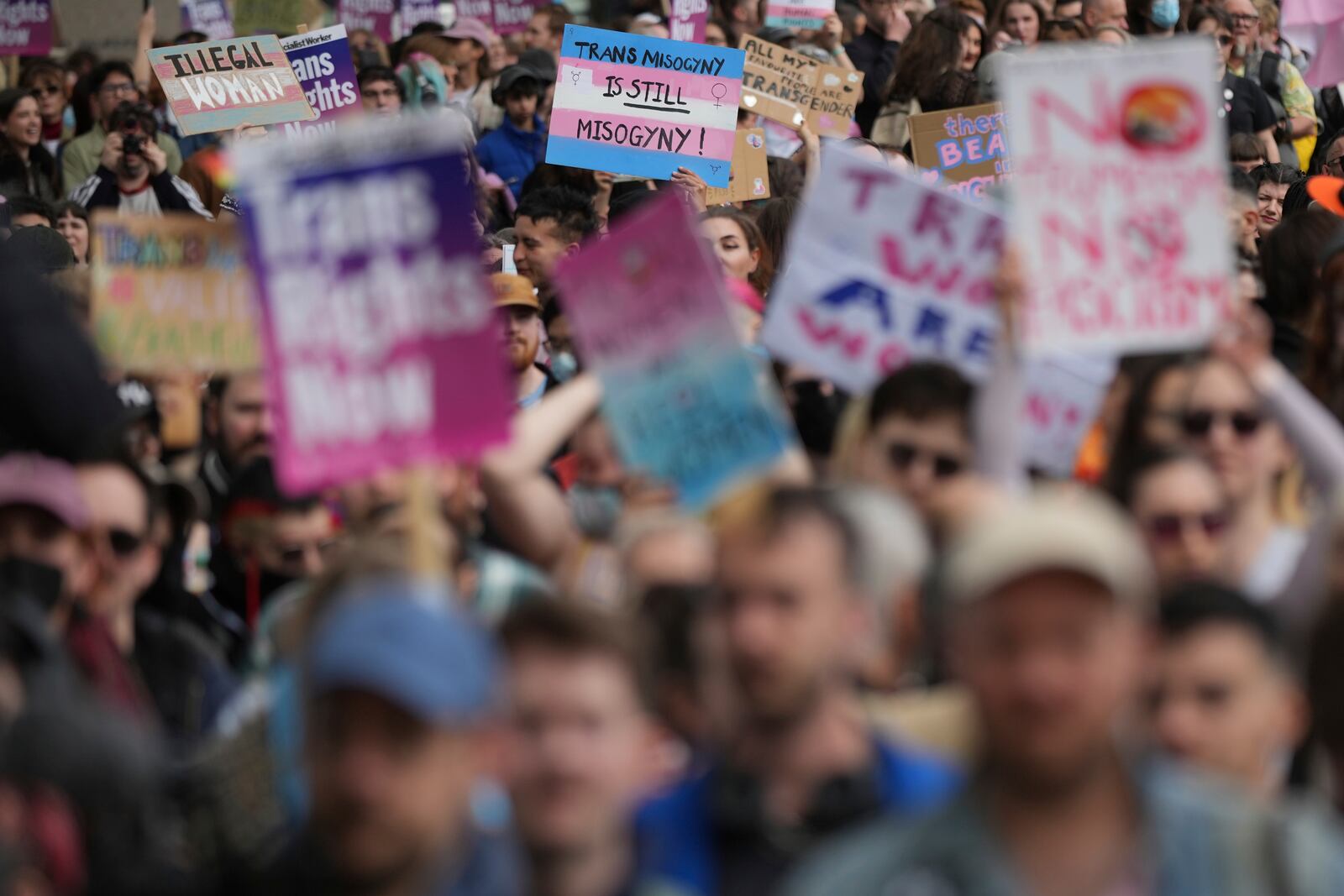 Campaigners take part in a rally organised by trans rights groups, trade unions, and community organisations following the Supreme Court ruling on the definition of a woman in equalities law, at Parliament Square, central London, Saturday April 19, 2025. (AP Photo/Alastair Grant)