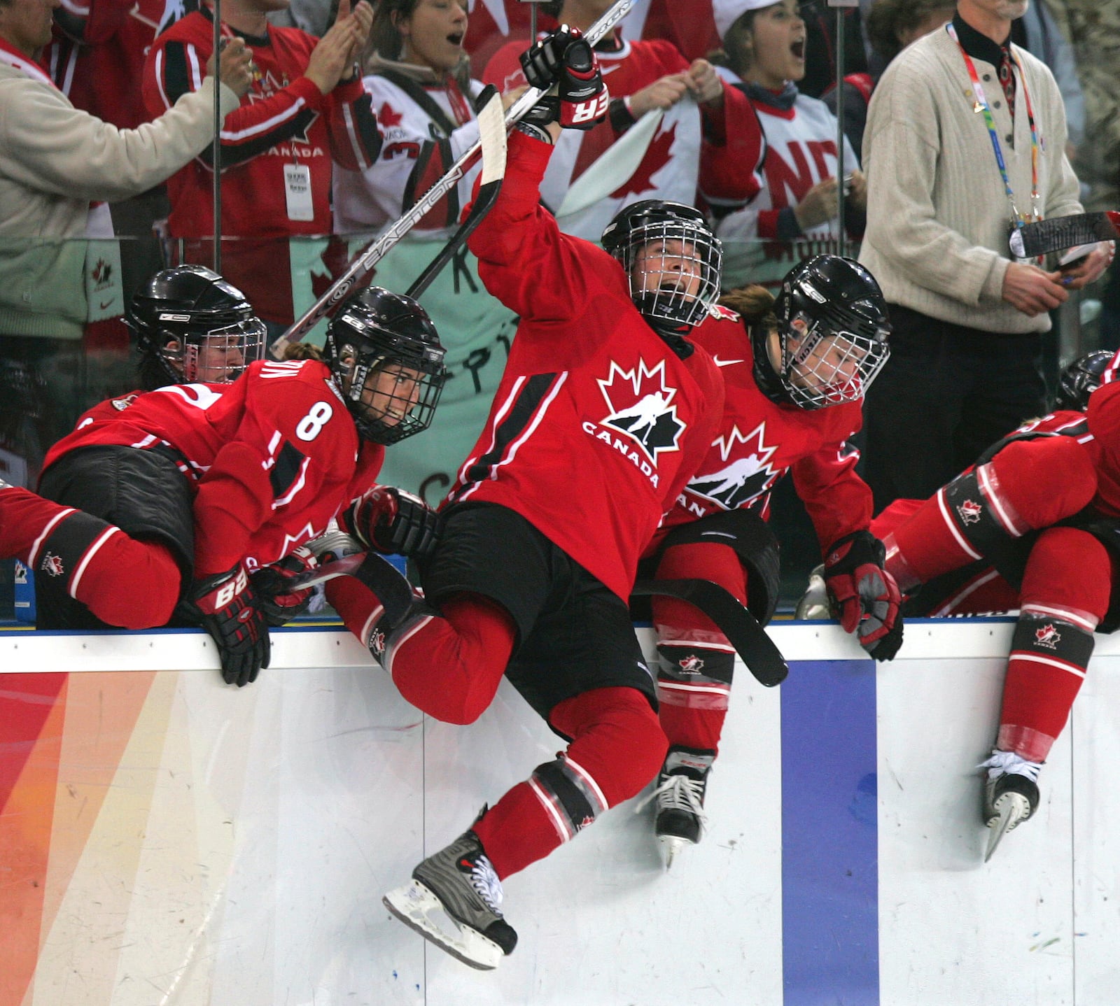 FILE - Team Canada's Jennifer Botterill, center, and other team members leap from the bench to celebrate defeating Sweden 4-1 in the women's ice hockey gold medal match at the 2006 Turin Winter Olympic Games in Turin, Italy on Feb. 20, 2006. (AP Photo/Julie Jacobson, File)