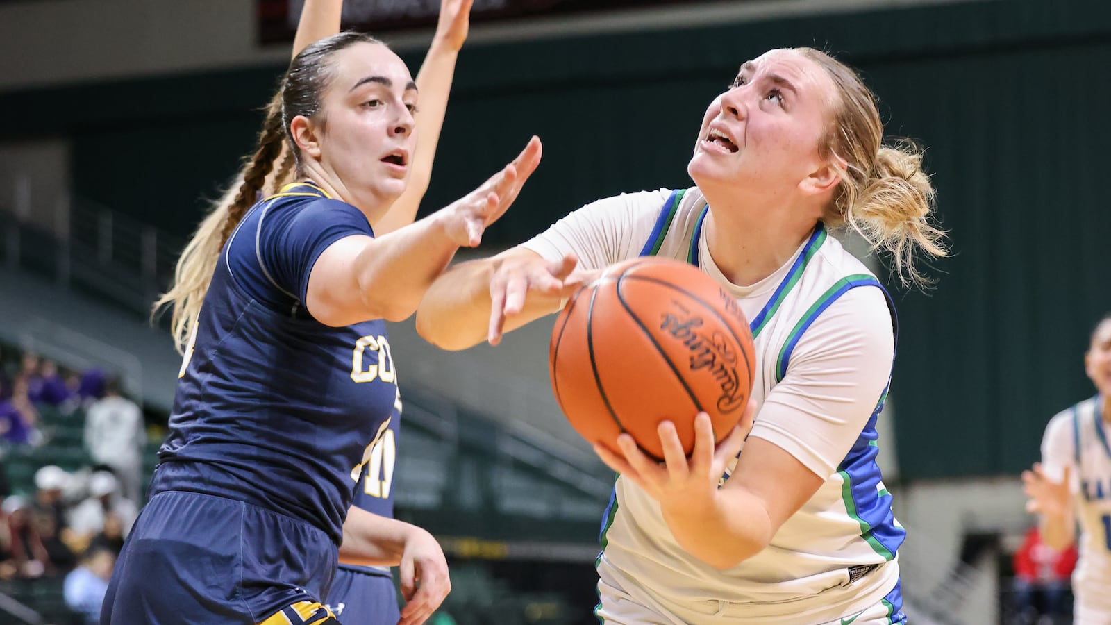 Chaminade-Julienne senior guard Maggie Bush shoots with pressure from Copley's Alejandro Morrondo-Garcia during the second quarter of a Division III state semifinal on Thursday, March 12 at Ervin J. Nutter Center in Fairborn. Bush scored 15 points and had five rebounds, three assists and three steals. BRYANT BILLING / STAFF