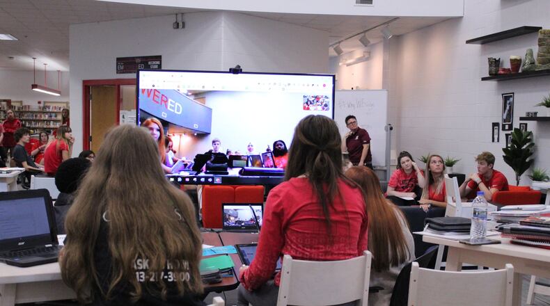 Hundreds of students at Lakotas’ two high schools are fulfilling their foreign language requirements by taking classes in American Sign Language (ASL). The district is also using video conferencing, collaborative learning (pictured) so students from the Lakota East and Lakota West high schools can learning ASL from one another. (Provided photo/Journal-News)