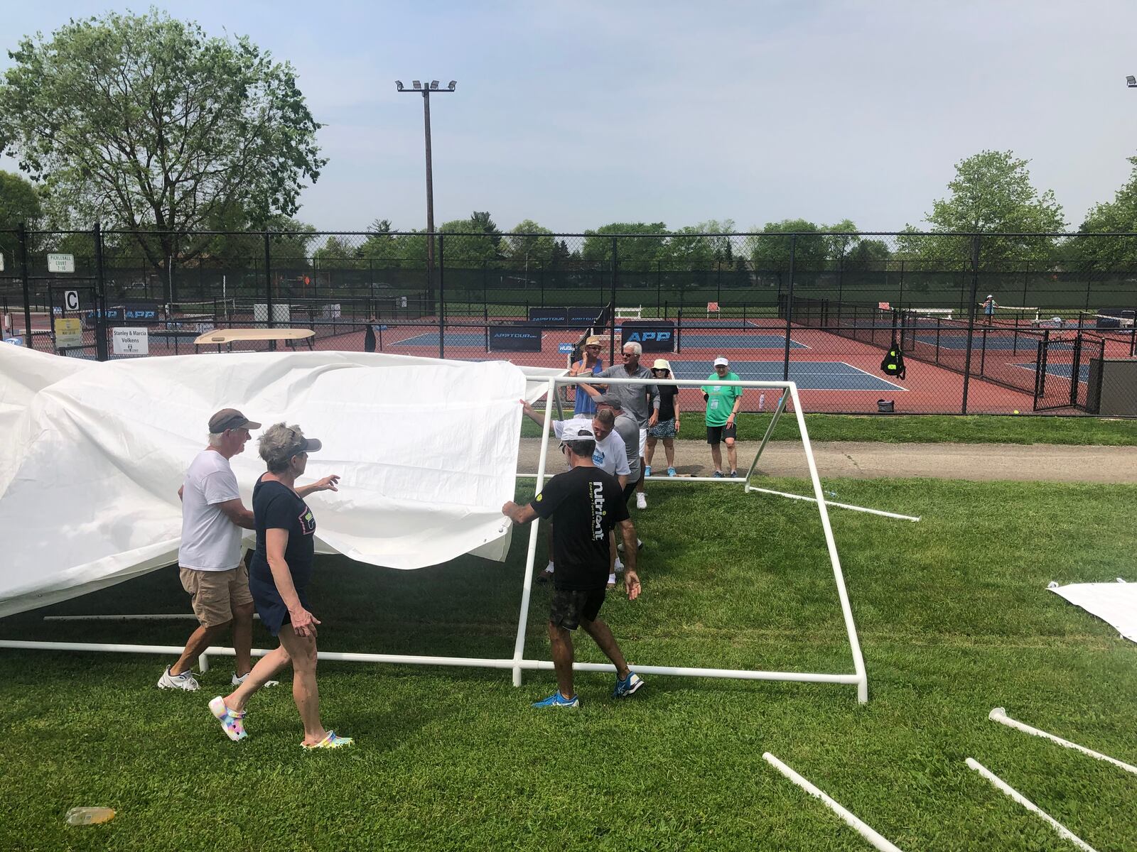 Many volunteers were busy Wednesday afternoon preparing for the national pickleball tournament coming to Middletown this weekend. RICK McCRABB/STAFF