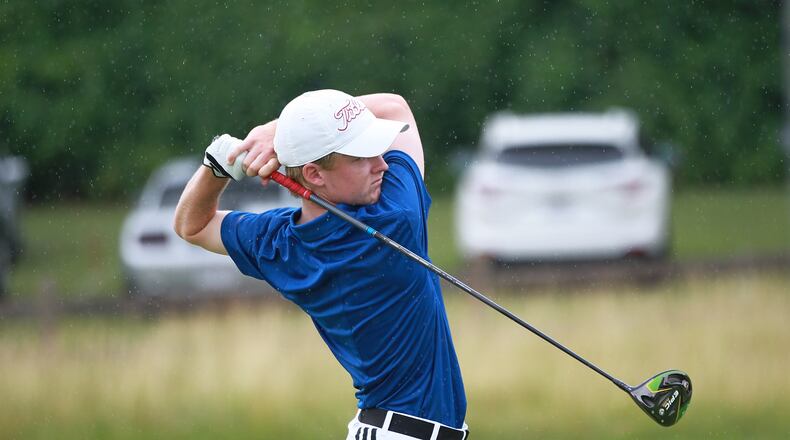 Tyler Goecke watches his tee shot on the first hole Wednesday in the 113th Ohio Amateur Championship at Moraine Country Club. John Boyle/STAFF