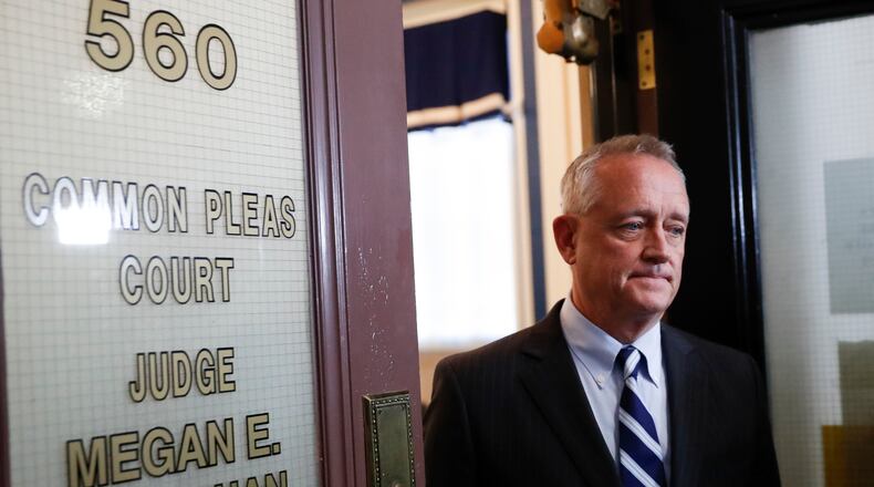 Hamilton County Prosecutor Joseph Deters leaves court after Common Pleas Court Judge Megan Shanahan declares a mistrial due to a hung jury in the murder trial against Ray Tensing, Saturday, Nov. 12, 2016, in Cincinnati. Tensing, the former University of Cincinnati police officer, is charged with murdering Sam DuBose while on duty during a routine traffic stop on July 19, 2015. (AP Photo/John Minchillo)