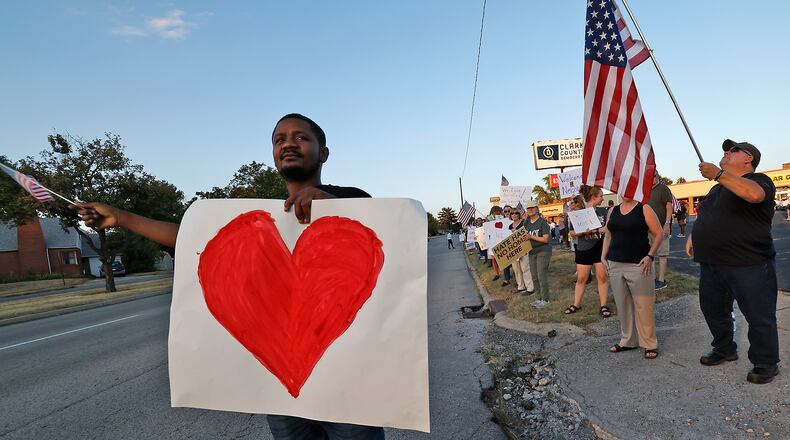 Petuel Jeanjacques, a Haitian immigrant, participates in a Peace Rally at the Clark County Democratic Party on Park Road in Springfield Wednesday, Sept. 18, 2024. BILL LACKEY/STAFF