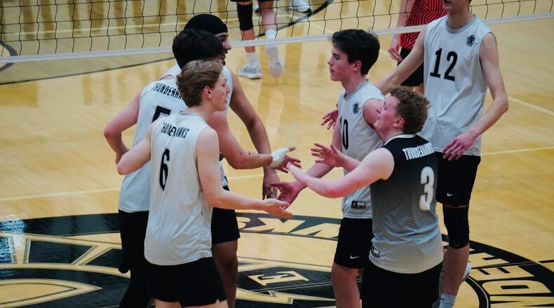 The Lakota East High School boys volleyball team celebrates a point during its game against Lakota West earlier this season. CHRIS VOGT / CONTRIBUTED