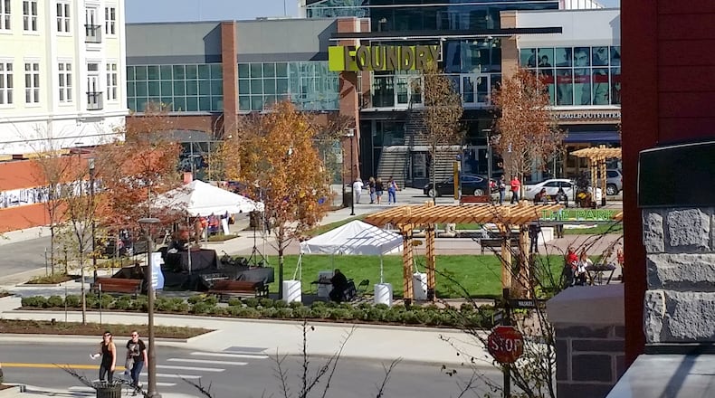 Visitors shop at the stores at the Liberty Center. GREG LYNCH / STAFF