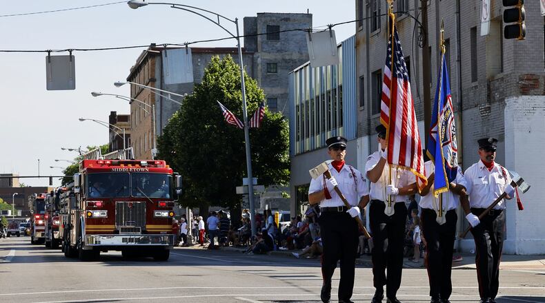 Middletown held its Fourth of July parade this year with the route running from Smith Park to Woodside Cemetery. Middletown Division of Fire Honor Guard marches in the parade. NICK GRAHAM/STAFF