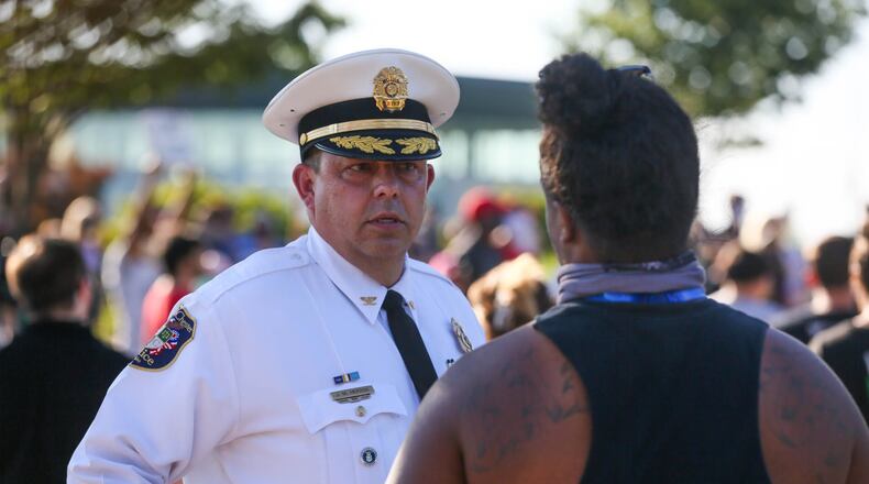 Protesters gathered at the West Chester Clock Tower Tuesday, June 2, 2020, for a peaceful event that included chants and speakers as protests continue throughout the region after the death last week of a Minnesota man in police custody. West Chester Police Chief Joel Herzog speaks to one of the organizers. GREG LYNCH / STAFF