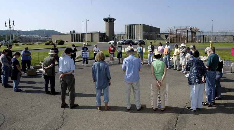 Death penalty opponents hold a vigil outside the Southern Ohio Correctional Facility at Lucasville, where Marvallous Keene was executed in 2009 for his role in Dayton's "Christmas killing" spree in 1992. DAYTON DAILY NEWS ARCHIVE