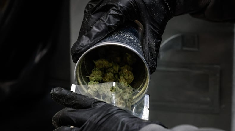 Recreational marijuana is processed and packaged in a back room at Amazing Budz in Adrian, Michigan. JIM NOELKER/STAFF