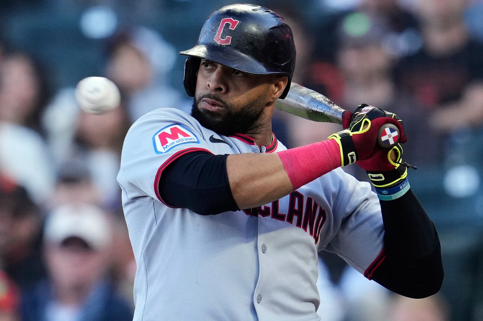 Cleveland Guardians' Carlos Santana leans away from a pitch during the first inning of a baseball game against the San Francisco Giants, Wednesday, June 18, 2025, in San Francisco. (AP Photo/Godofredo A. Vásquez)