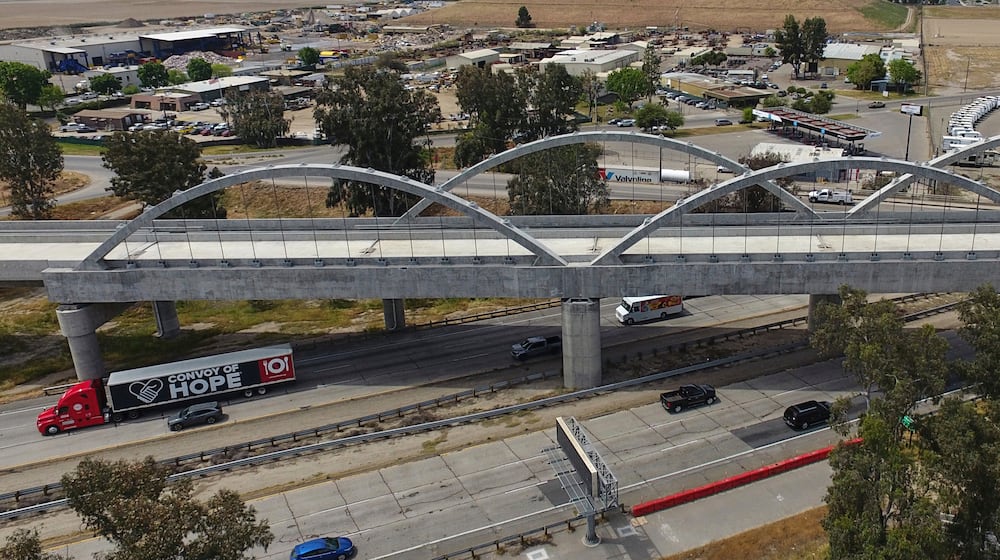 FILE - The Cedar Viaduct, designed to take high-speed trains over Cedar and North avenues and State Route 99, is shown in an aerial view, Tuesday, April 15, 2025, in Fresno, Calif. (AP Photo/Godofredo A. Vásquez, File)