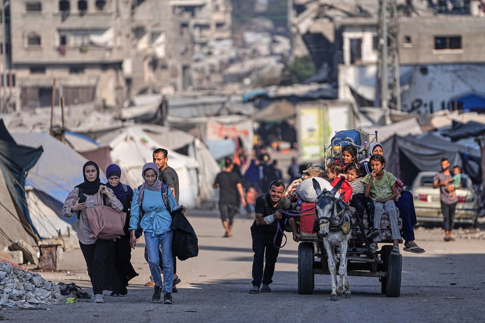 Displaced Palestinians flee Jabalia after the Israeli army issued evacuation orders in Gaza City, June 29, 2025. (AP Photo/Jehad Alshrafi)