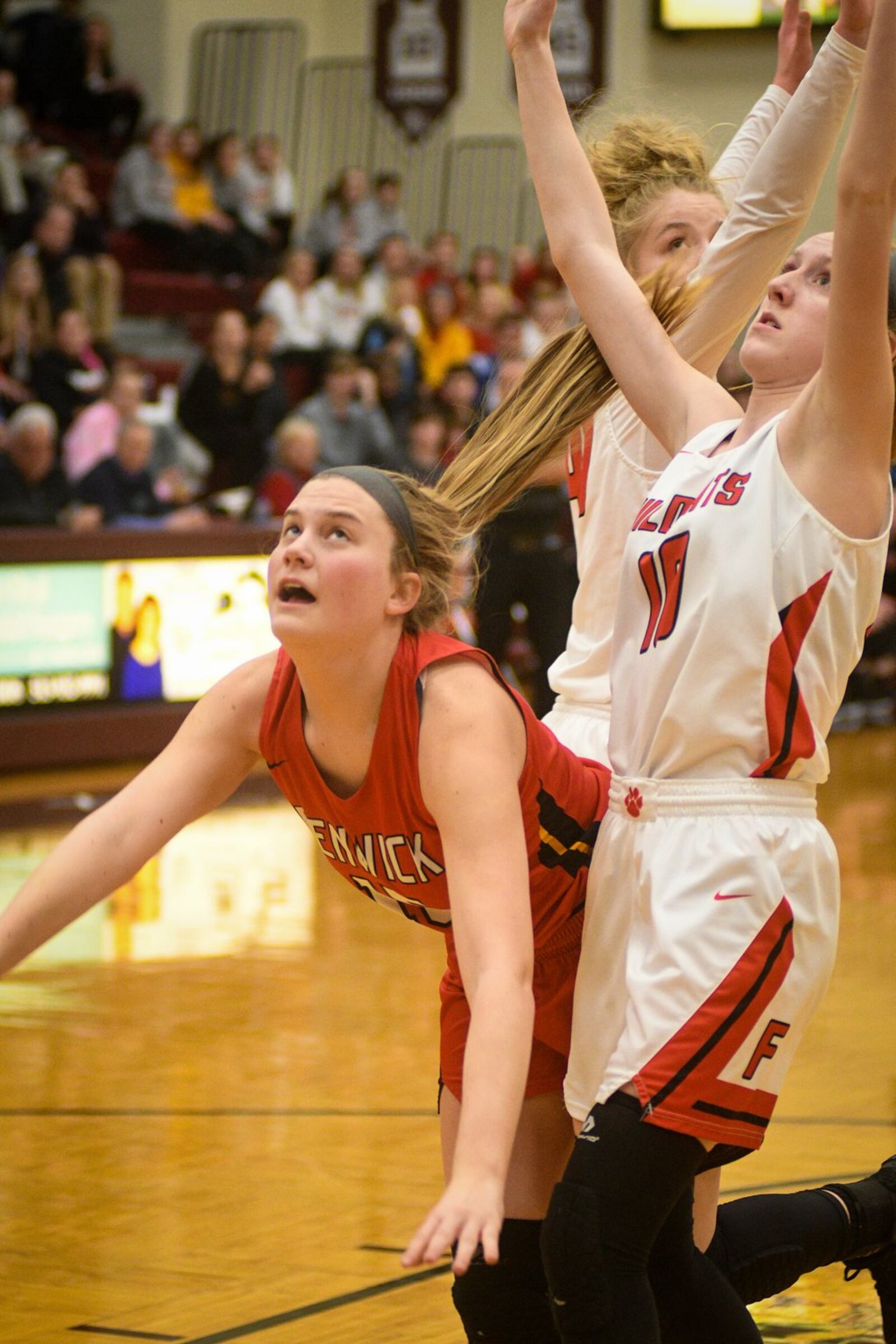 Fenwick’s Hannah Beckman watches her shot as Franklin’s Jordan Rogers (10) plays defense during Monday night’s Division II district basketball semifinal at Lebanon. Franklin won 47-35. ROB MCCULLEY/RAM PHOTOGRAPHY