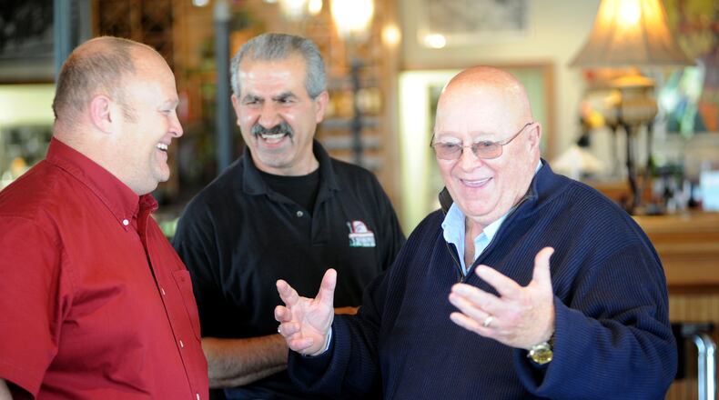 Fairfield mayor Ron D'Epifanio talks to his son Craig, left, of Fairfield Twp., after arriving at his surprise 70th birthday party at The Spinning Fork in Fairfield on Wednesday, May 4, 2011. Staff photo by Samantha Grier.
