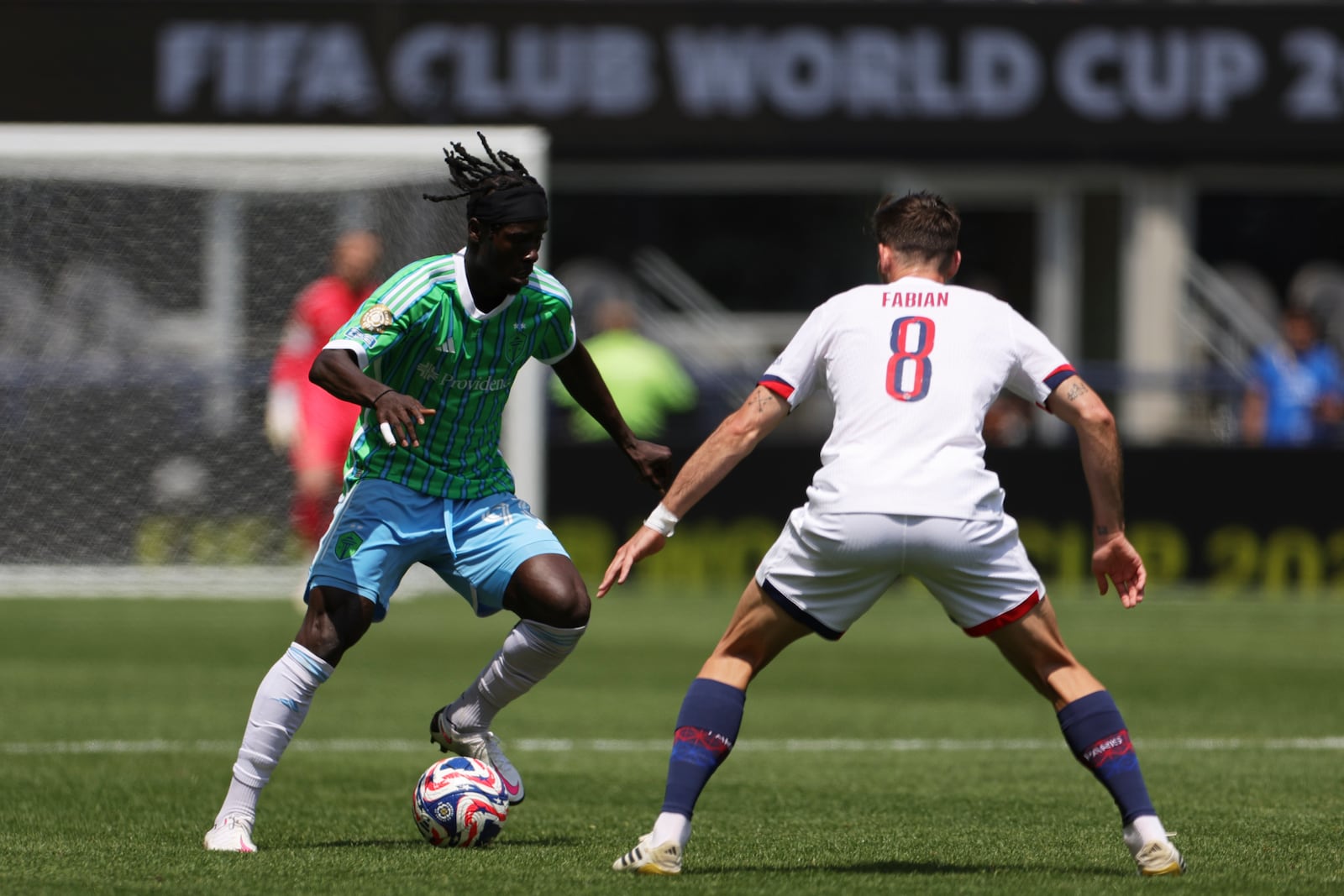 Seattle Sounders' Georgi Minoungou, left, controls the ball as Paris Saint-Germain's Fabian Ruiz defends during the Club World Cup Group B soccer match between Seattle Sounders and PSG in Seattle, Monday, June 23, 2025. (AP Photo/Ryan Sun)
