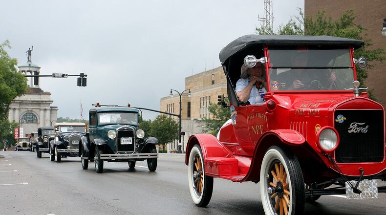 The 70th Annual Antique and Classic Car Parade of Hamilton and Fairfield will be held from 8:30 a.m.-5 p.m. July 27 starting at the Butler County Courthouse in Hamilton. The parade will head to Fairfield at 1 p.m. Photo is cars cruising down High St. during a previous year's parade. E.L. HUBBARD/FILE