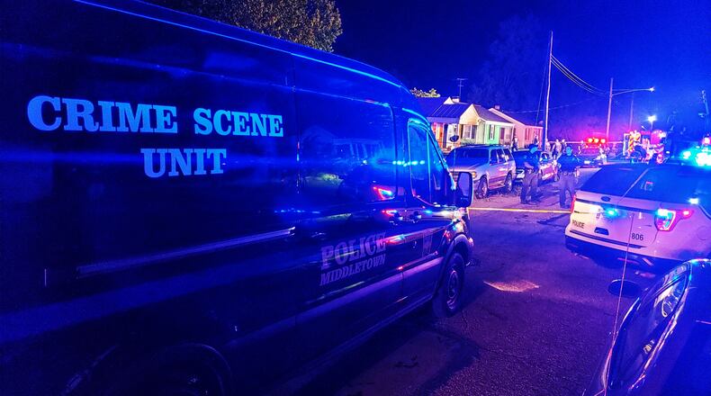 Middletown fire and police crews responded to a house fire Friday evening, Aug. 14, 2020, in the 1200 block of Lind Street. NICK GRAHAM/STAFF