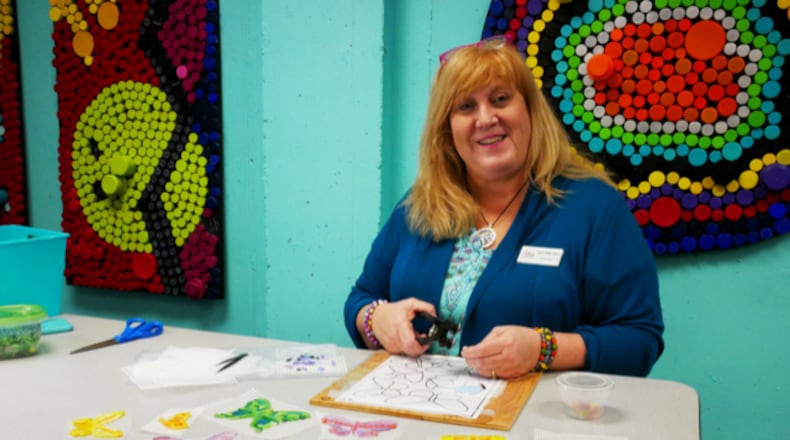 The Fitton Center will host a mosaic mural dedication for “Wings of Hope” on Tues., Aug. 31 at 5:30 p.m. “Wings of Hope,” a collaborative, community mosaic mural, will be on permanent display on several exterior columns of the pergola at the Fitton Center. Pictured is Lori Kay Farr, lead artist and project leader. CONTRIBUTED