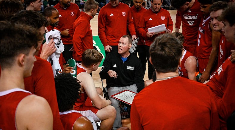 Miami (Ohio) Head Coach Travis Steele talks to his team during the second half of an NCAA college Basketball game against Marshall, Saturday, Feb. 7, 2026, in Huntington, W.Va. (AP Photo/Tyler Evert)