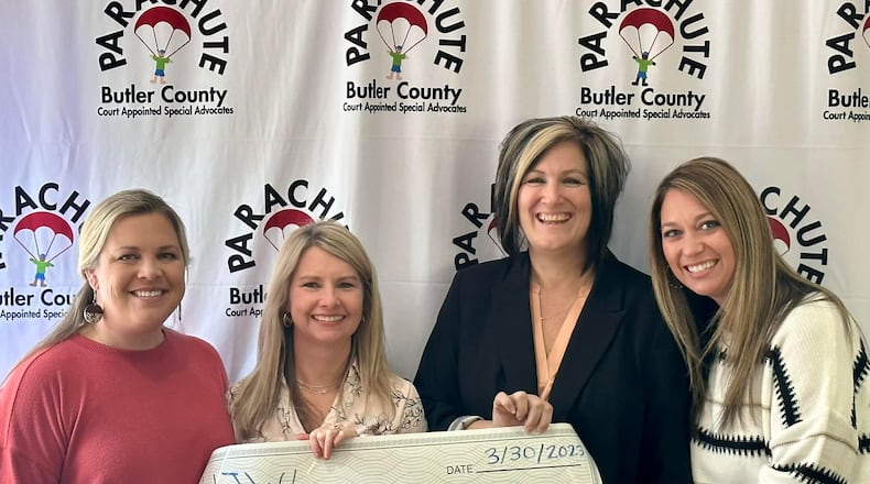 The Hamilton Junior Women’s League (HJWL) raised $25,000 for PARACHUTE: Butler County Court Appointed Special Advocate (CASA). The league held the Eat. Drink. Give – Masquerade Ball in February. Pictured with the check donation, from left are Jana Davis, HJWL president; Christy Schroeder, HJWL Eat. Drink. Give. event chair; Tonya Buchanan, executive director Parachute: Butler County CASA; and Jill Martin, HJWL Eat. Drink. Give. sponsorship chair. CONTRIBUTED