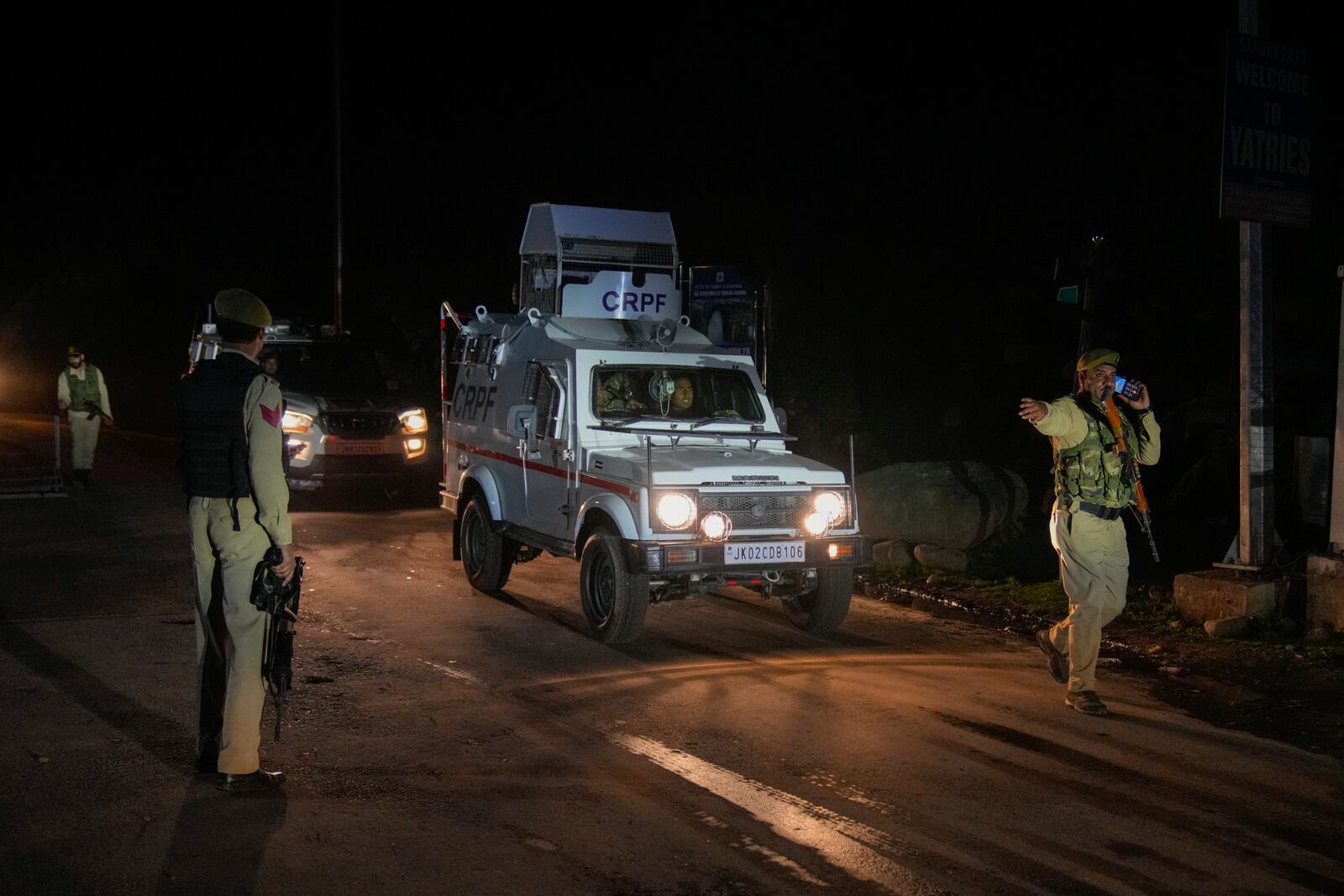 Indian police officers stands guard at a check point near Pahalgam in south Kashmir after assailants indiscriminately opened fired at tourists visiting Pahalgam, Indian controlled Kashmir, Tuesday, April 22, 2025.(AP Photo/Dar Yasin)