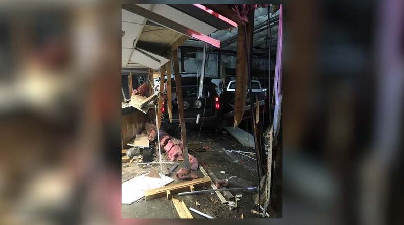 A car traveling west on Oxford State Road sideswiped another vehicle Tuesday night, then crashed into Art’s Parts, 2080 Oxford State Road. Police are looking for the driver of the at-fault vehicle. SUBMITTED PHOTO