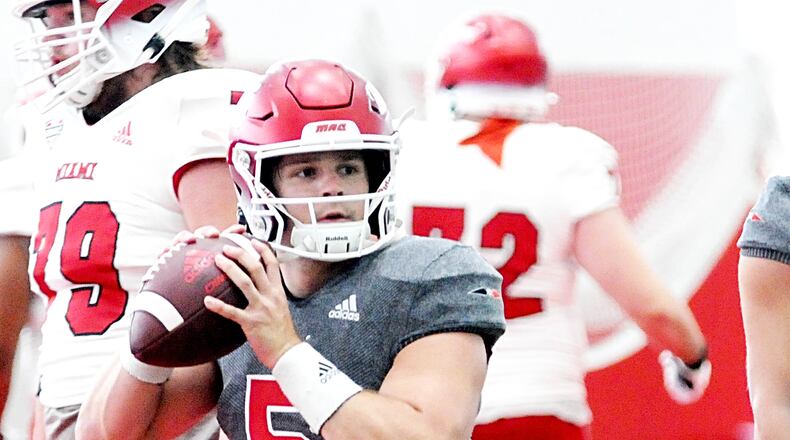 Miami University quarterback Brett Gabbert looks to make a pass during the Spring Showcase at the David and Anita Dauch Indoor Sports Center on Saturday, April 22. DAVID A. MOODIE/CONTRIBUTING PHOTOGRAPHER